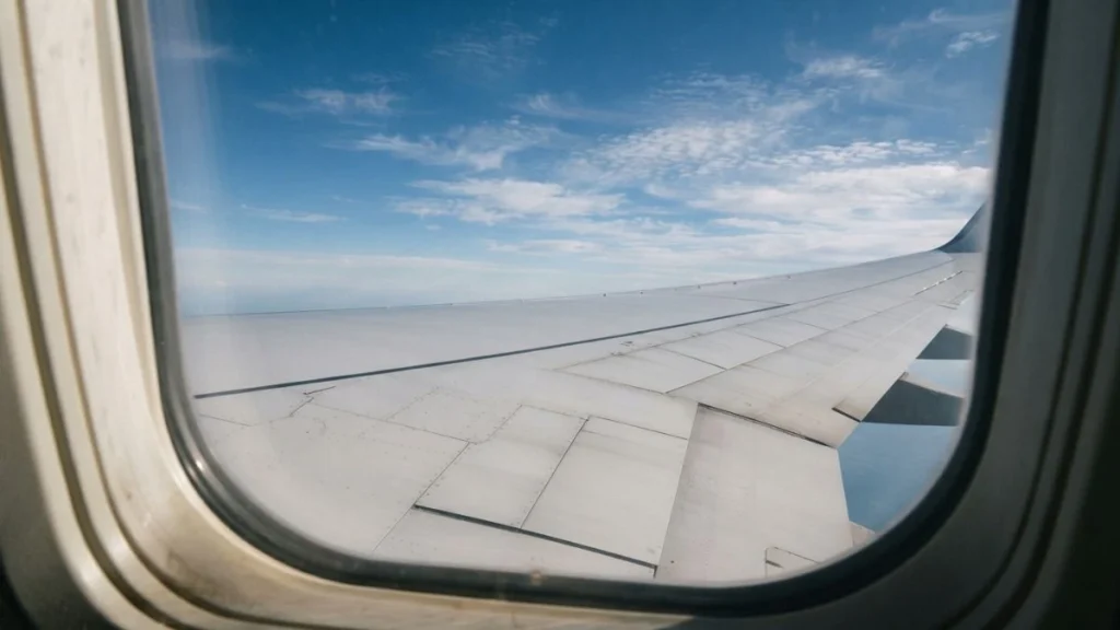 Aircraft flying through high-altitude air showing atmospheric conditions linked to turbulence
