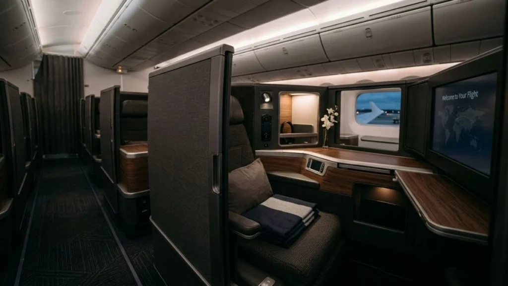 Business class suite with sliding privacy door on a widebody aircraft